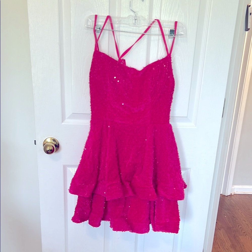 Sparkling Pink Strappy Dress
Size 4
Adjustable back and built in bra 
Never worn